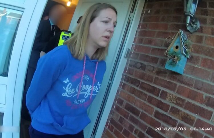 (FILES) This file handout image taken from police bodycam footage released by Cheshire Constabulary police force in Manchester on August 17, 2023 shows nurse Lucy Letby being arrested at home in Chester on July 3, 2018. A Netflix documentary released on February 4, 2026 about Letby, the former UK nurse jailed for life for murdering seven babies, is taking a fresh look at the puzzling case of the prolific child killer. Letby, from Hereford, western England, was charged in 2020 following a string of deaths at a hospital's neo-natal unit and found guilty in 2023. (Photo by Handout / Cheshire Constabulary / AFP) / RESTRICTED TO EDITORIAL USE - MANDATORY CREDIT  " AFP PHOTO / CHESHIRE CONSTABULARY/ HANDOUT "  -  NO MARKETING NO ADVERTISING CAMPAIGNS   -   DISTRIBUTED AS A SERVICE TO CLIENTS
